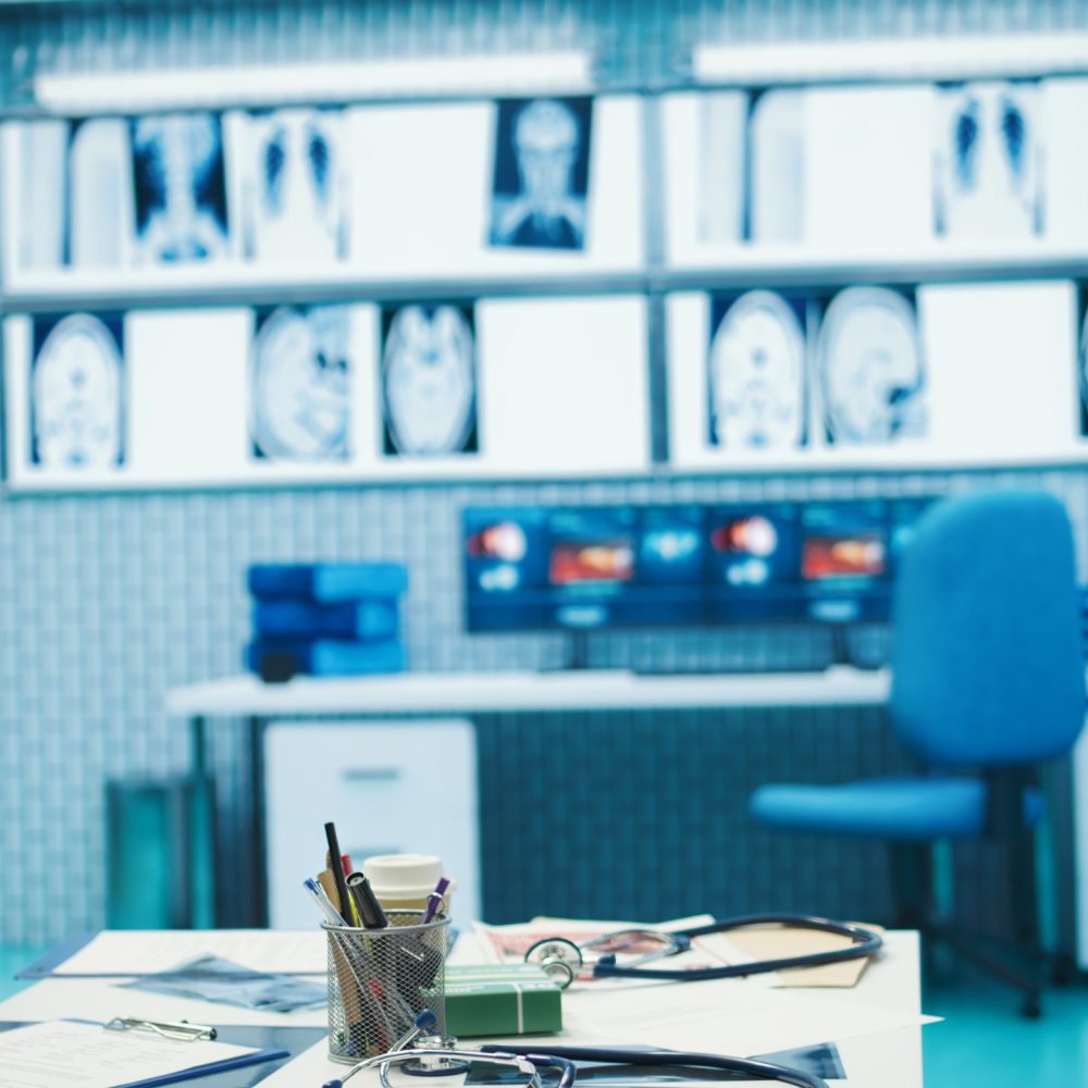 Empty medical office used by doctors to find the right diagnostic, equipped with modern tools as x ray machine. Private facility cabinet space with hospital records for healthcare industry.